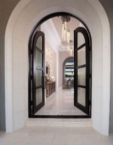 Spectacular light fixtures hung in this gorgeous Florida entryway