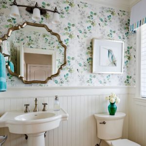 Beadboard and some floral wallpaper combine in this pretty bathroom