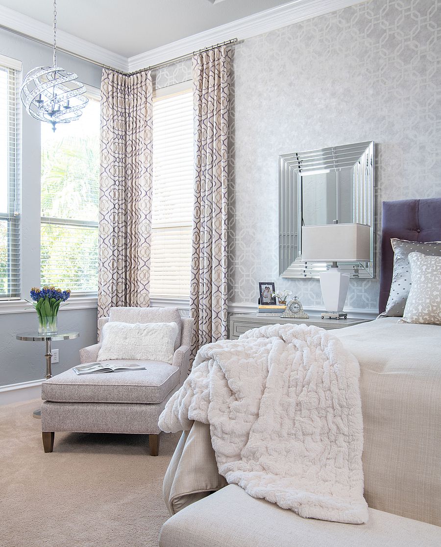 This lovely chaise lounge is placed perfectly in an unused corner of the home with natural light, a table for a book or drink, and a lamp for when evening comes.