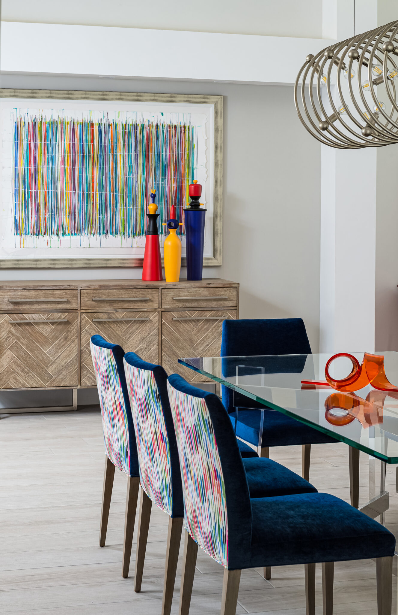 A fully custom dining room with outstanding chairs, beautiful wallpaper.